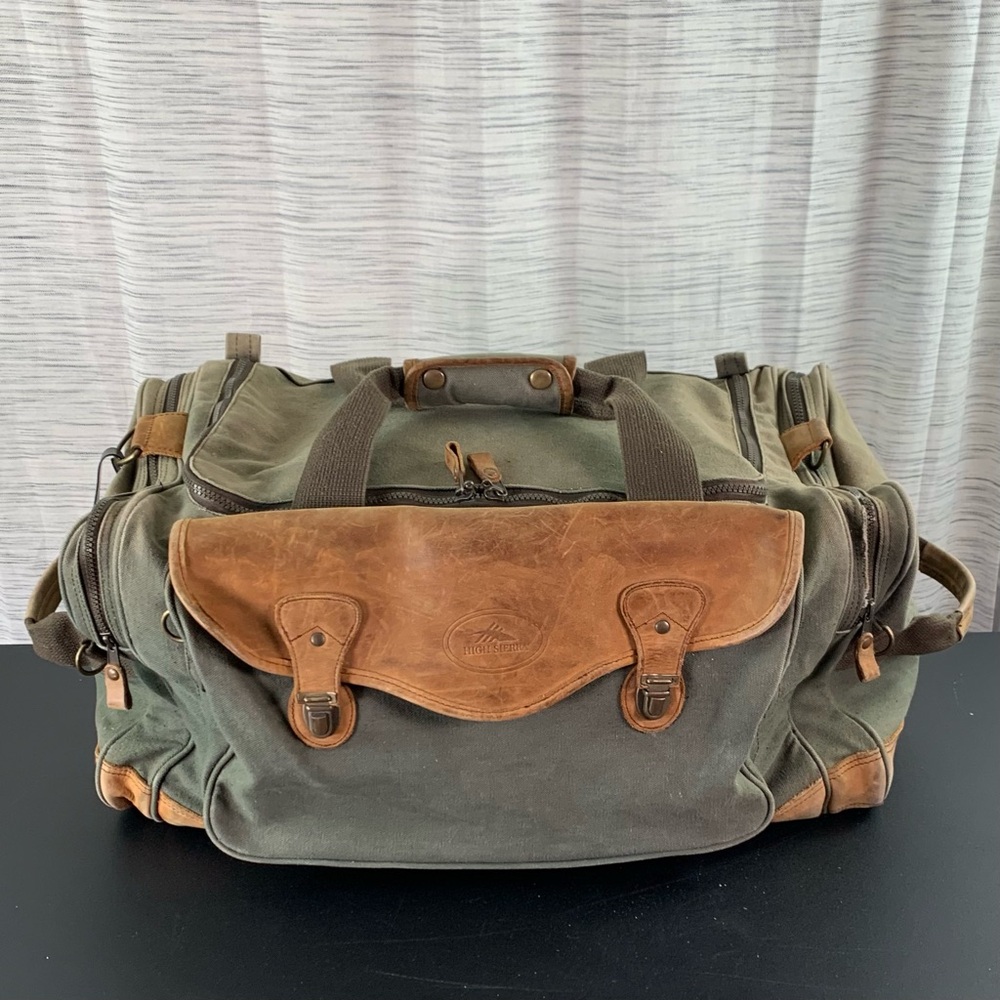 High Sierra Green canvas and Brown leather Duffel Bag.
